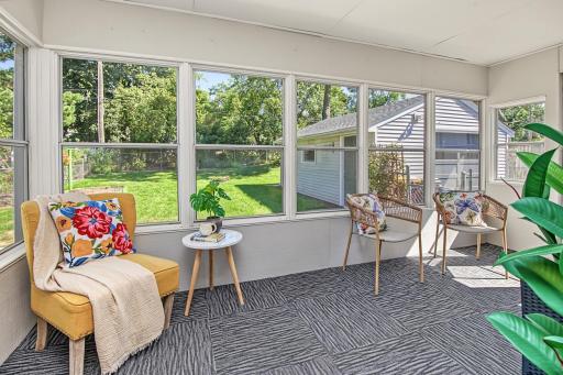 This porch is super cute and overlooks the beautifully maintained backyard oasis