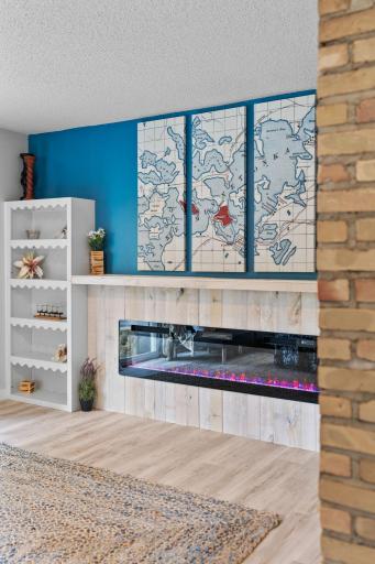 Newly added electric fireplace and feature wall