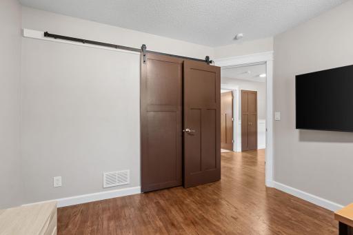 View of 3rd bedroom. New closet barn door in bedroom.