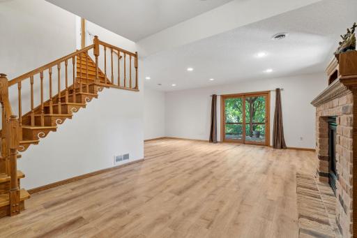 Make your way down to the finished lower level walkout! 2nd brick fireplace and plenty of space to entertain!