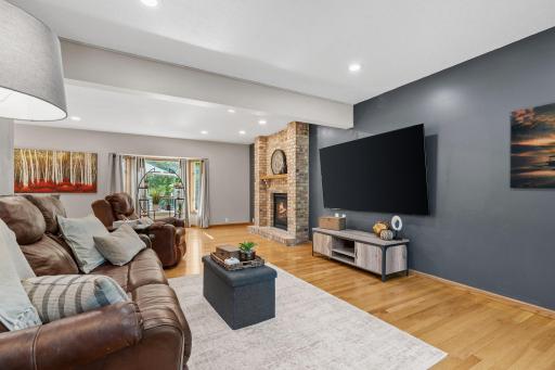 Hardwood floors throughout the main level - enjoy a spacious family room + brick fireplace.