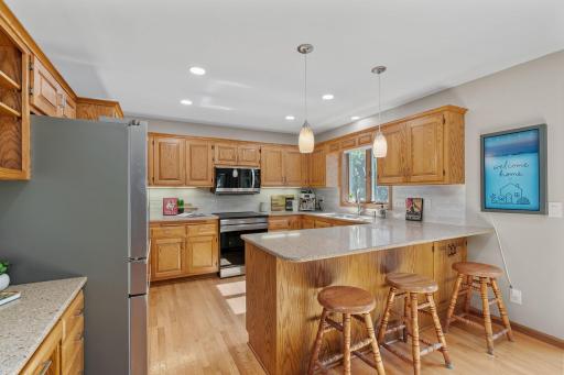 The kitchen! Kitchen appliances new in 2025, brand new backsplash & hardware throughout.