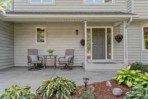 Concrete patio & driveway and thoughtful landscaping.