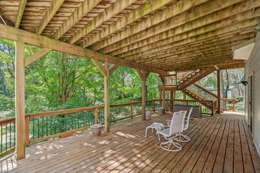 Access to the lower level deck from the walk out! More stunning views of the private backyard space.