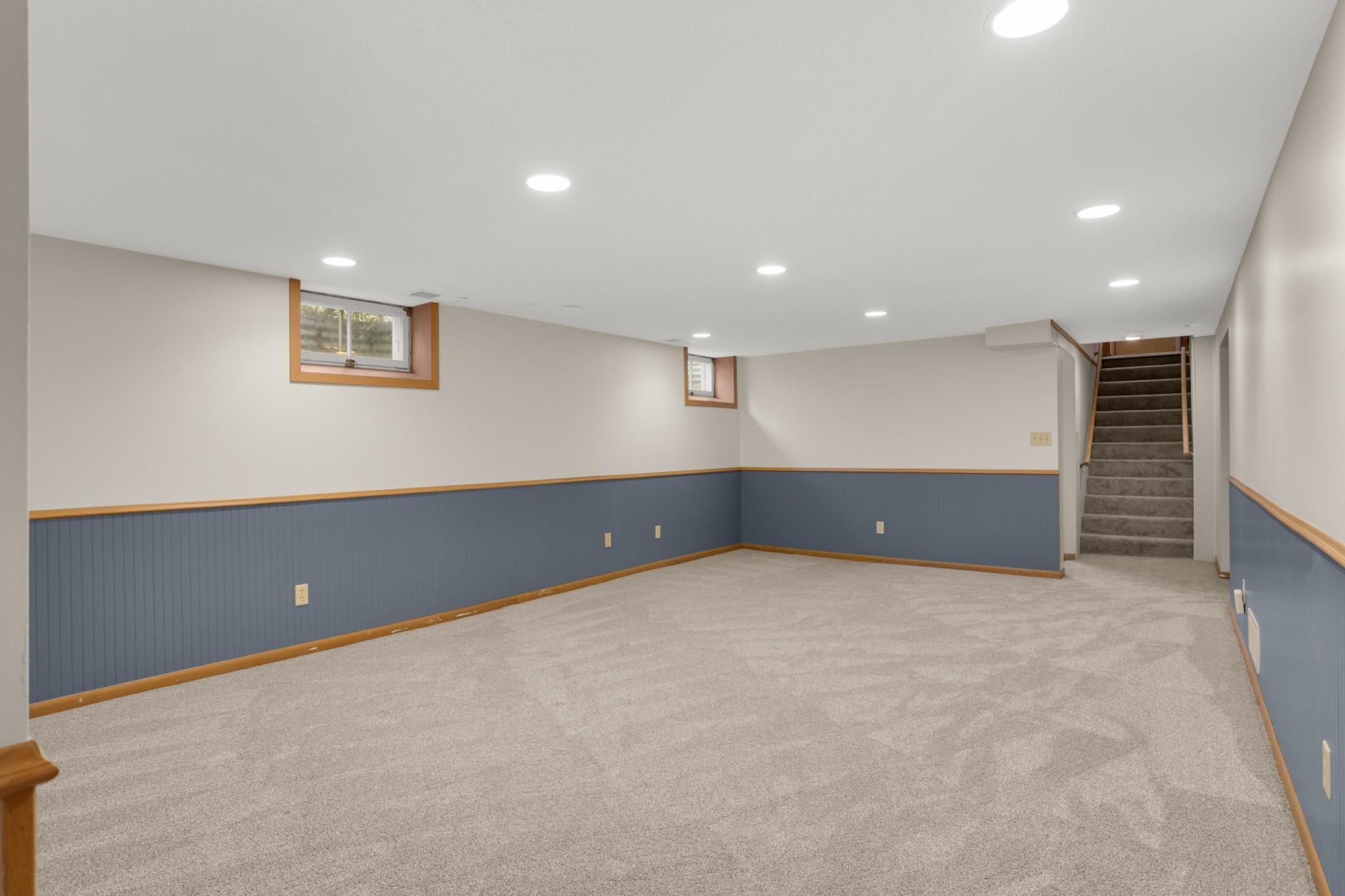 Lower level family room with new carpet adn fresh paint