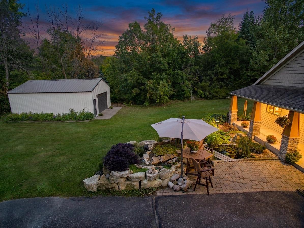 A relaxing waterfall, pond, and patio greet you at the door.