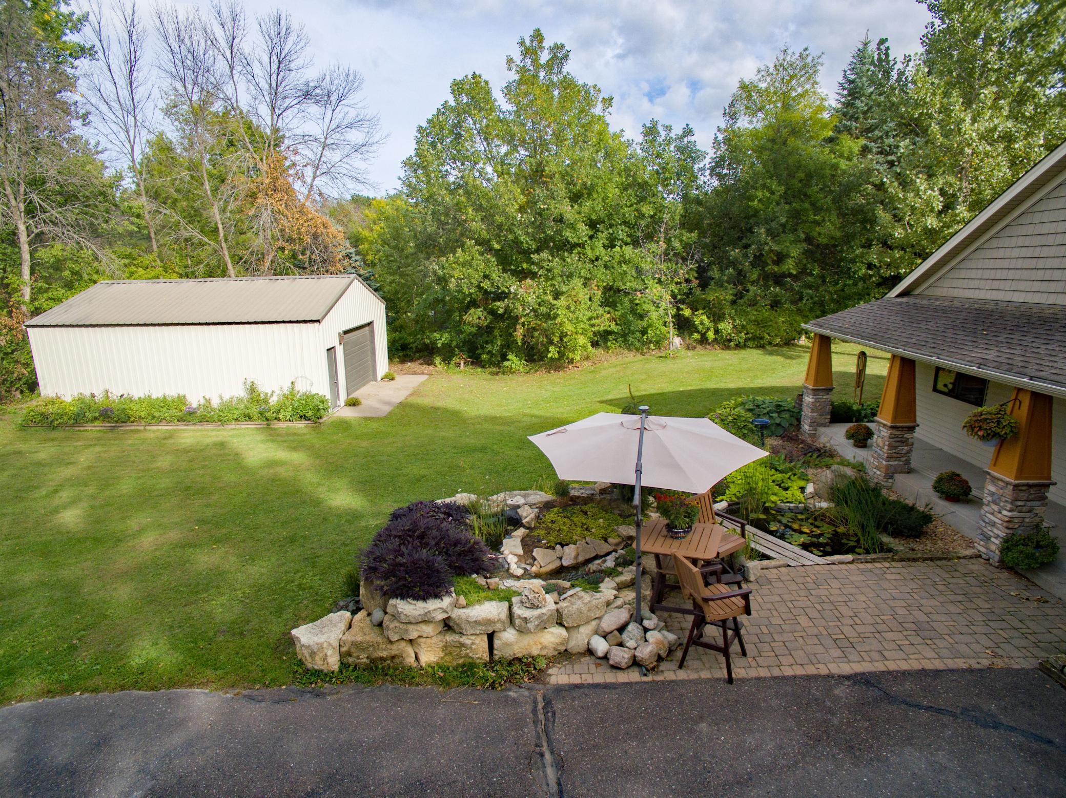 Water feature in the front of the home and generous outbuilding for your storage needs.