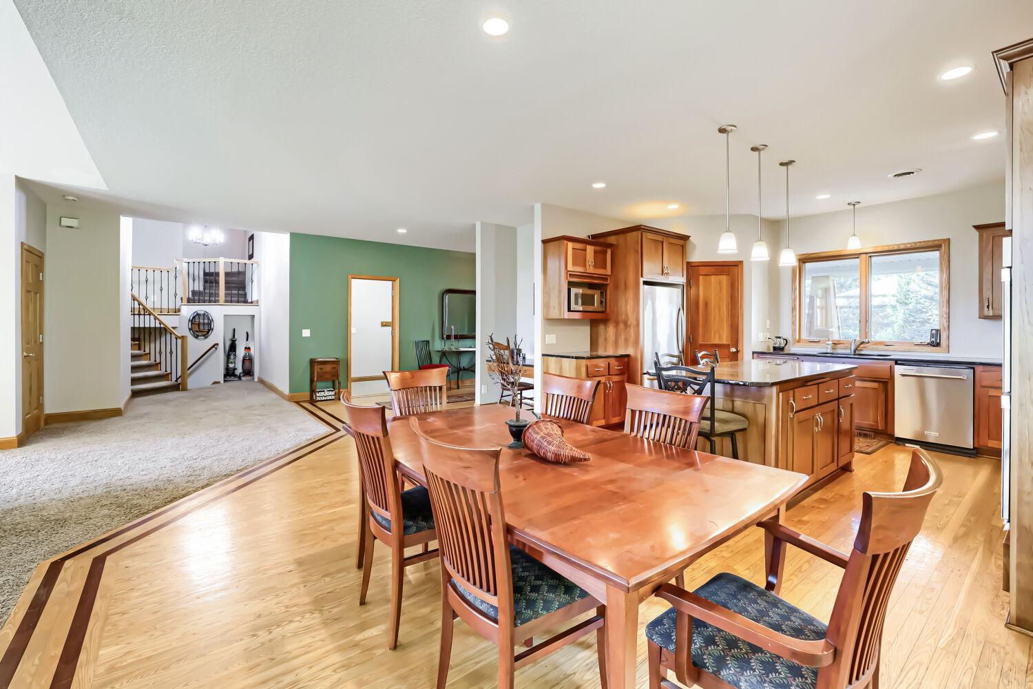 Gorgeous woodwork in the kitchen: cherry cabinets, black ash floors inlaid with Brazilian cherry racing stripes.