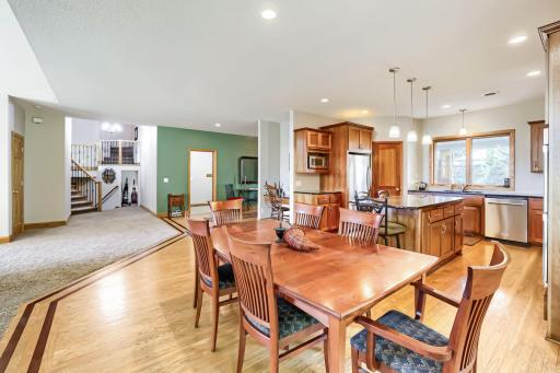 Gorgeous woodwork in the kitchen: cherry cabinets, black ash floors inlaid with Brazilian cherry racing stripes.
