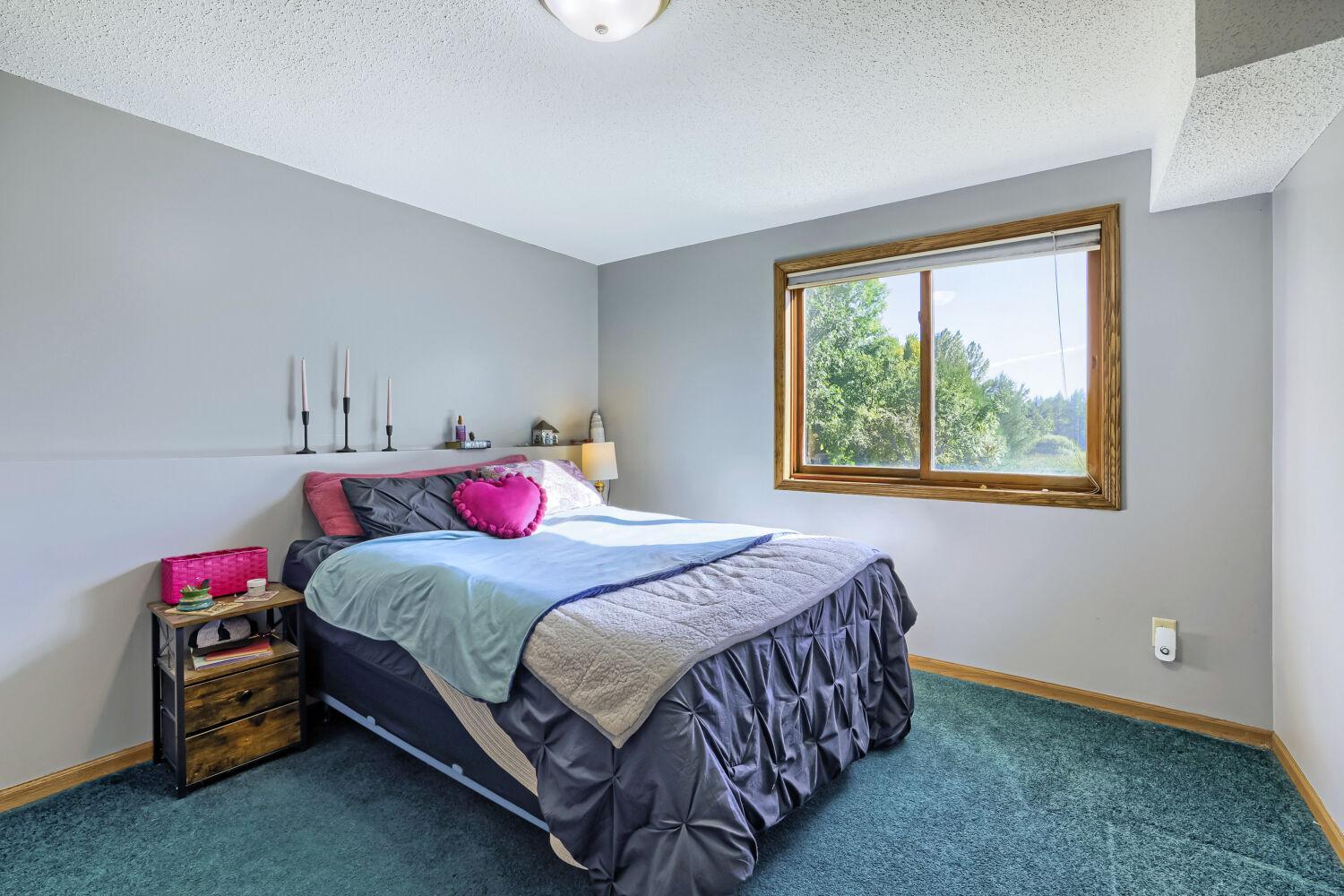 Lower level bedroom with lake views.