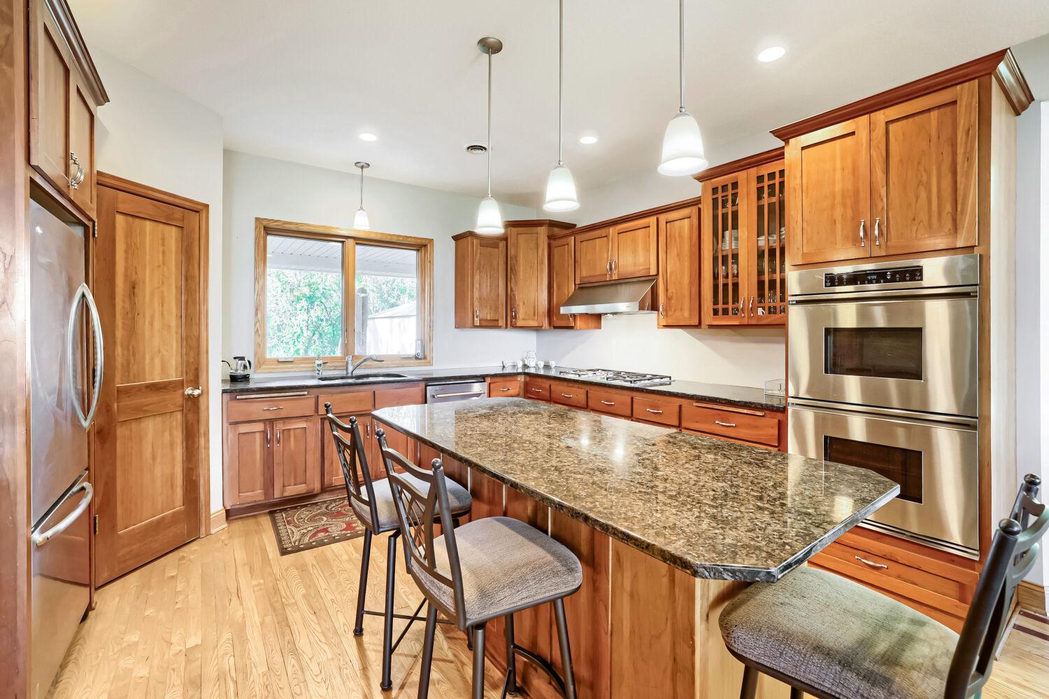 Granite countertops and stainless appliances.