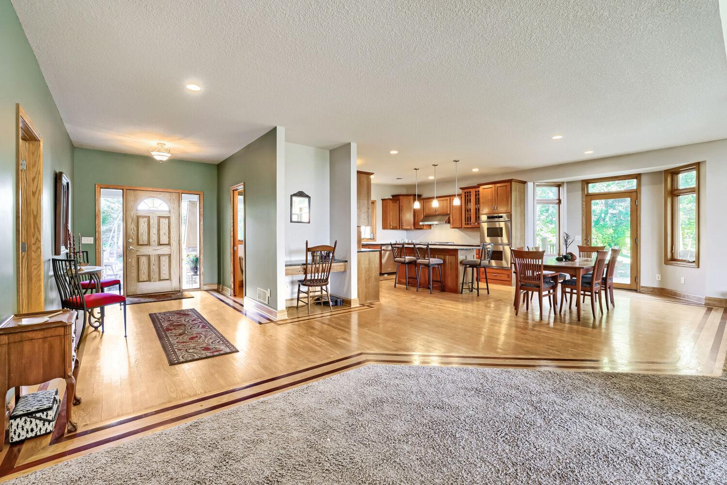 The main floor addition features a generous foyer, powder room, and amazing kitchen.