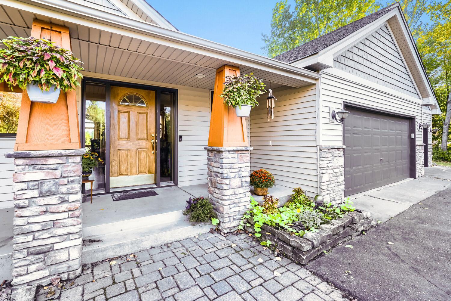A full length porch graces the front of the home.