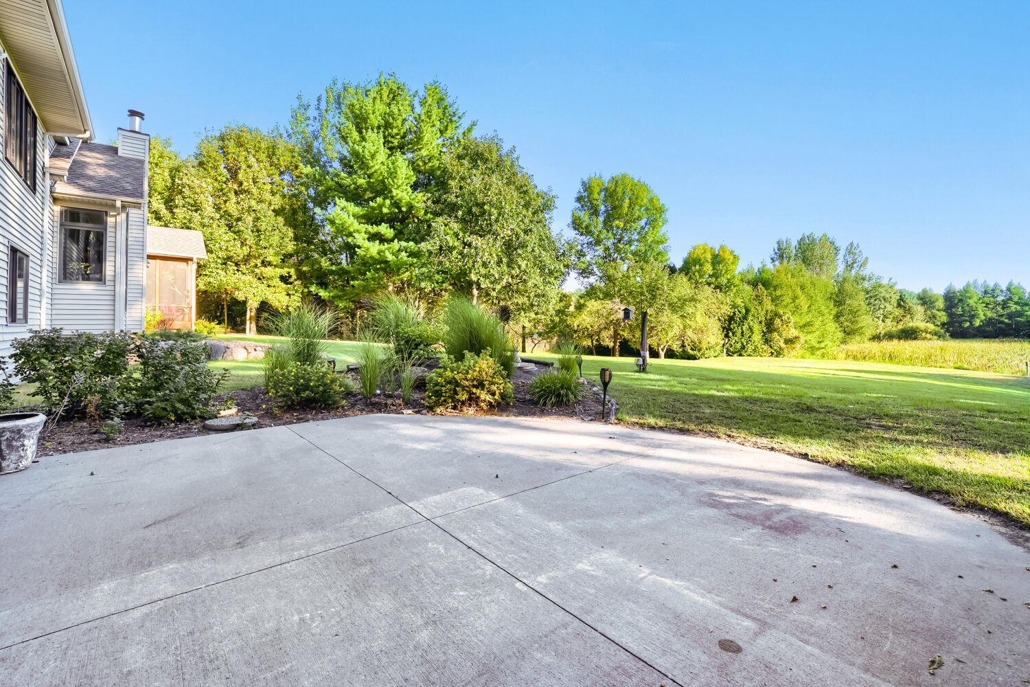 Cement patio accessible from the lower level family room.
