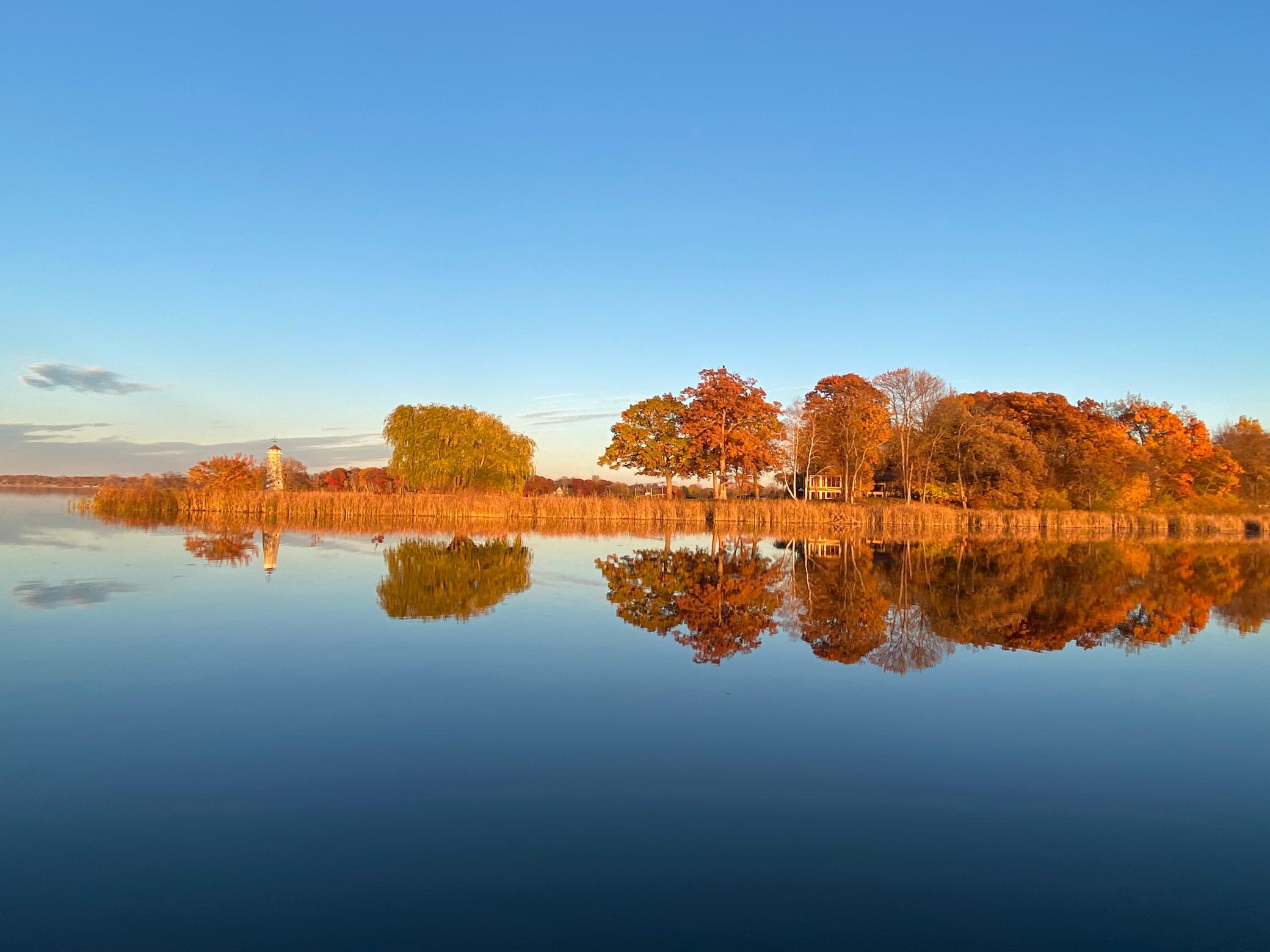 Glasslike water and blue skies
