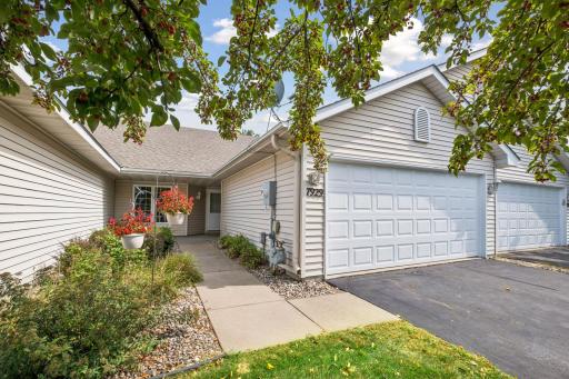 Follow the private sidewalk to the front entrance, surrounded by established landscaping with room to add your own personal touches.
