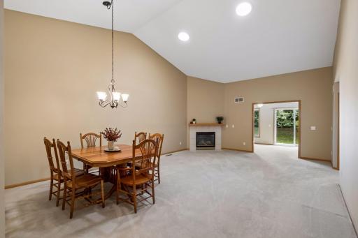 Wow! Vaulted ceilings and an open-concept living and dining area make this space feel bright, airy, and spacious.