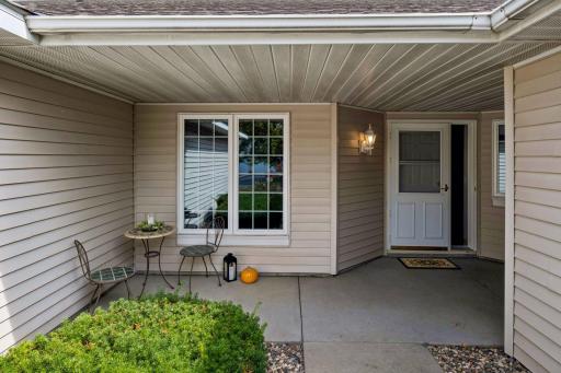 A charming front patio offers the perfect place to sit, relax, or welcome guests as they arrive.