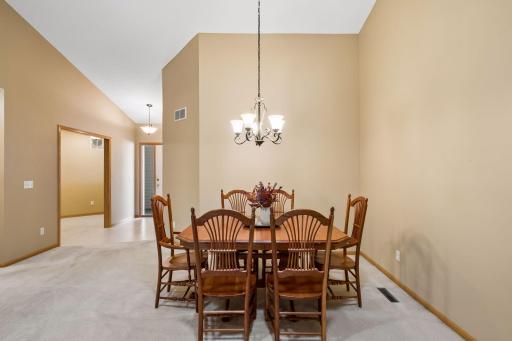 A dedicated dining area with a beautiful chandelier and plenty of room to gather and entertain.