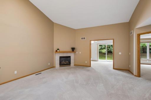 The gas fireplace creates a warm focal point in this wonderfully spacious living room.