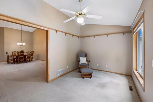 The sunroom is ready for relaxationâa wonderful bonus space to enjoy your morning coffee, a good book, or views of the backyard.
