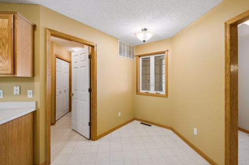 The eat-in kitchen offers additional dining space with convenient access to the laundry, mudroom, and garage.