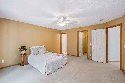 The generous primary bedroom leads to a large walk-in closet and private 3/4 ensuite bath.