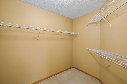 A large walk-in closet provides fantastic storage right off the primary bedroom.