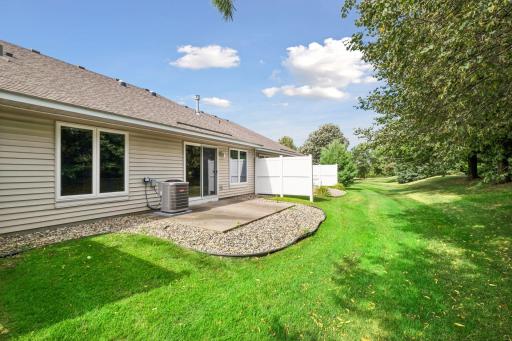 Another look at the expansive green space surrounding the back of the homeâa beautiful setting to enjoy throughout the seasons.