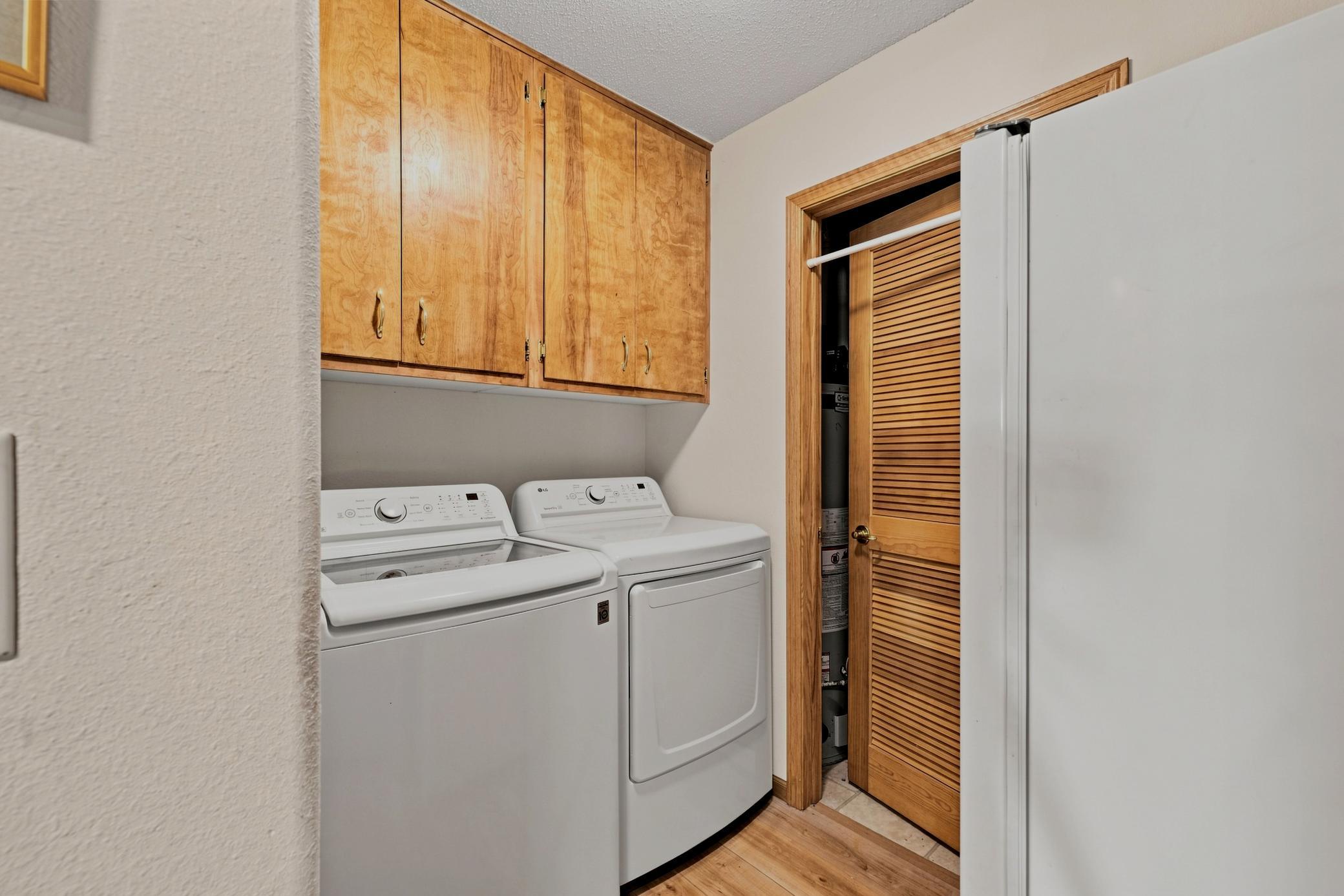Laundry Room offers storage, space for a freezer/fridge, access to utility room