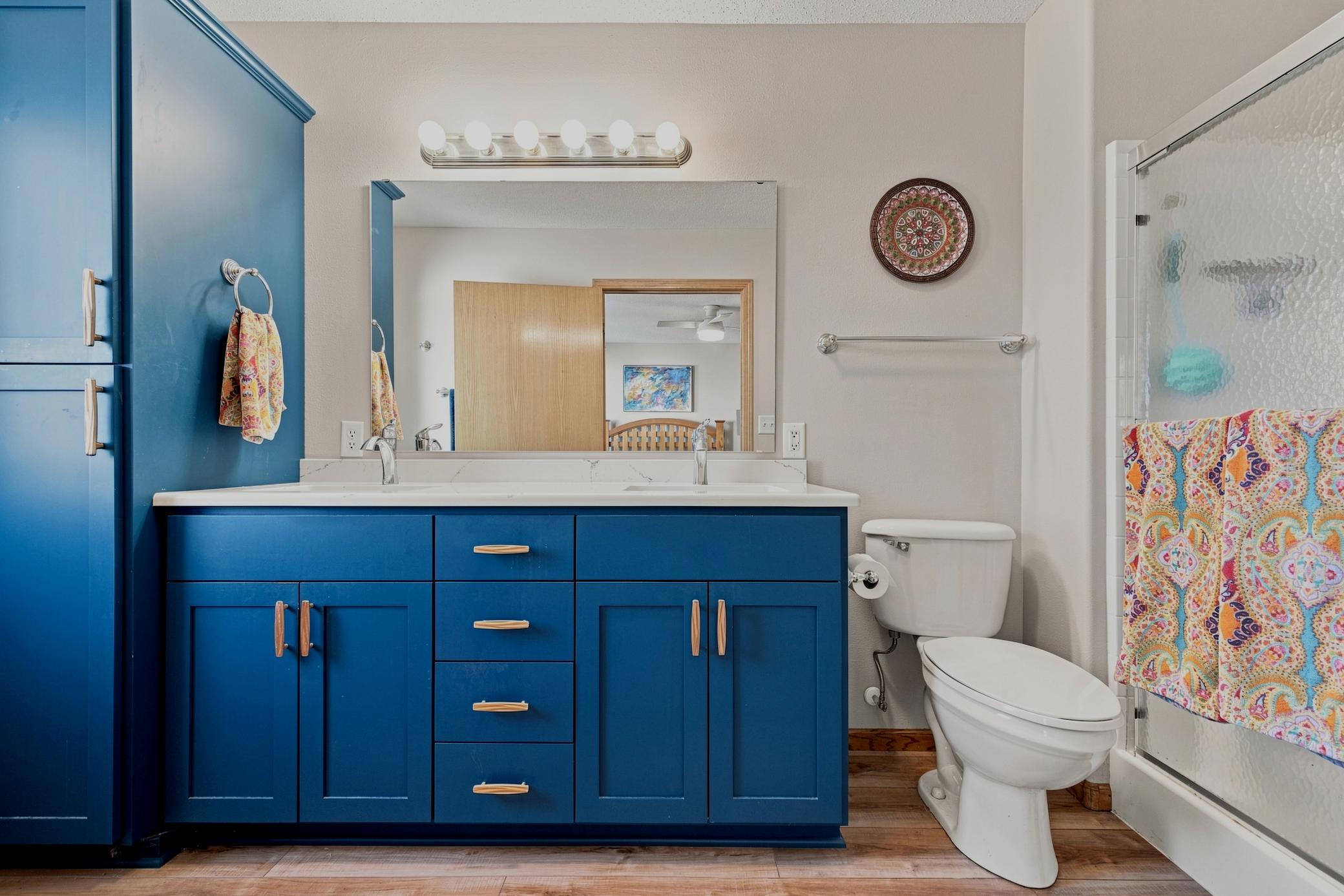 3/4 Primary Bath with double sinks and full linen cabinet
