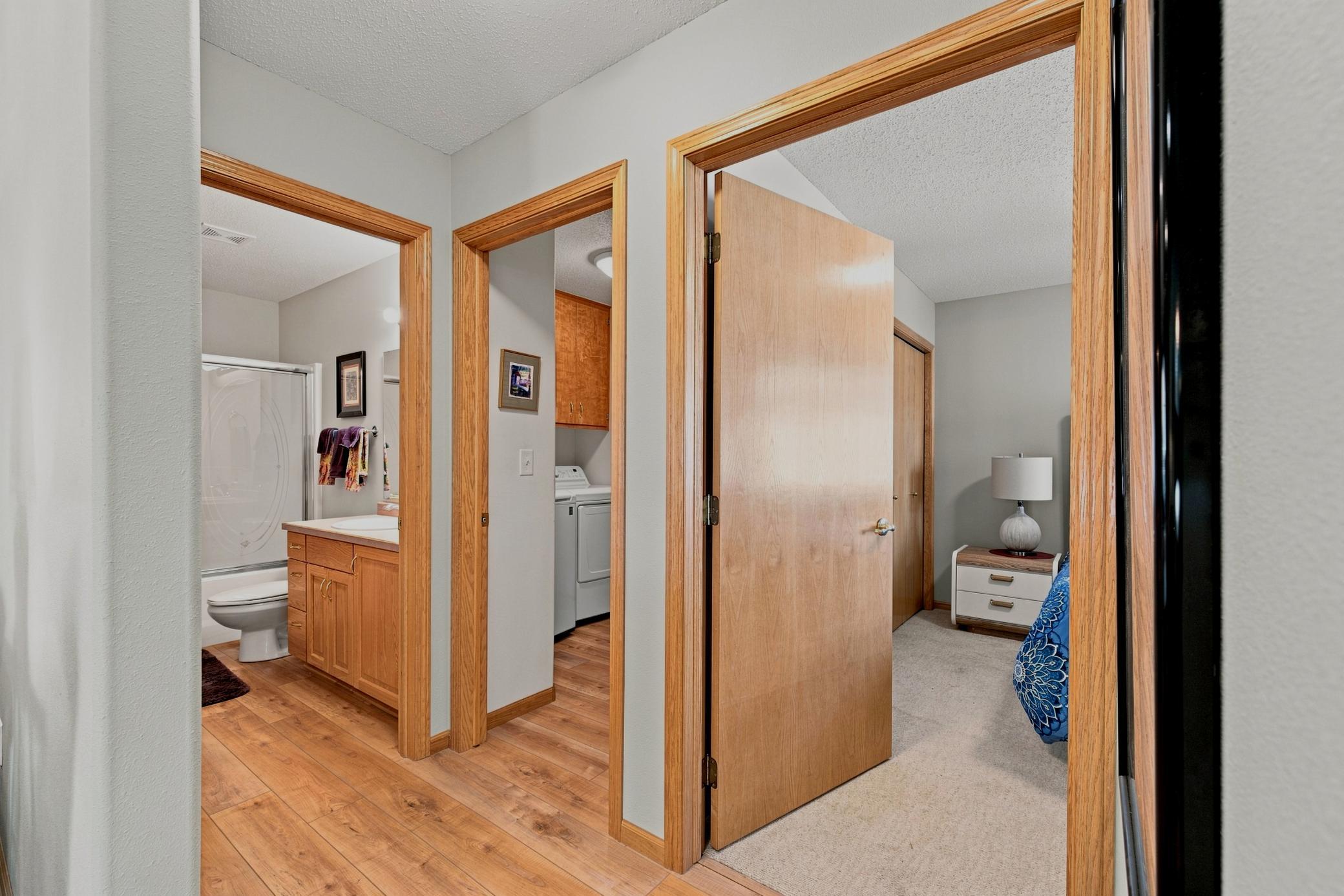 Hallway to Bedroom 2, laundry room, guest bathroom