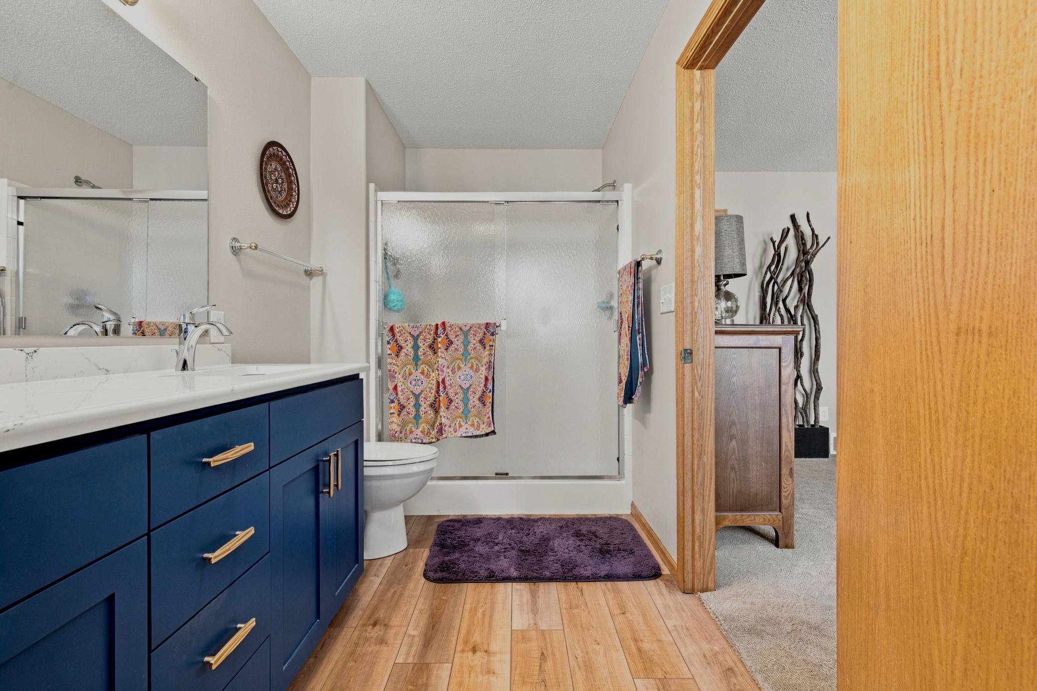 Primary Bath offers walk-in shower and dual sinks