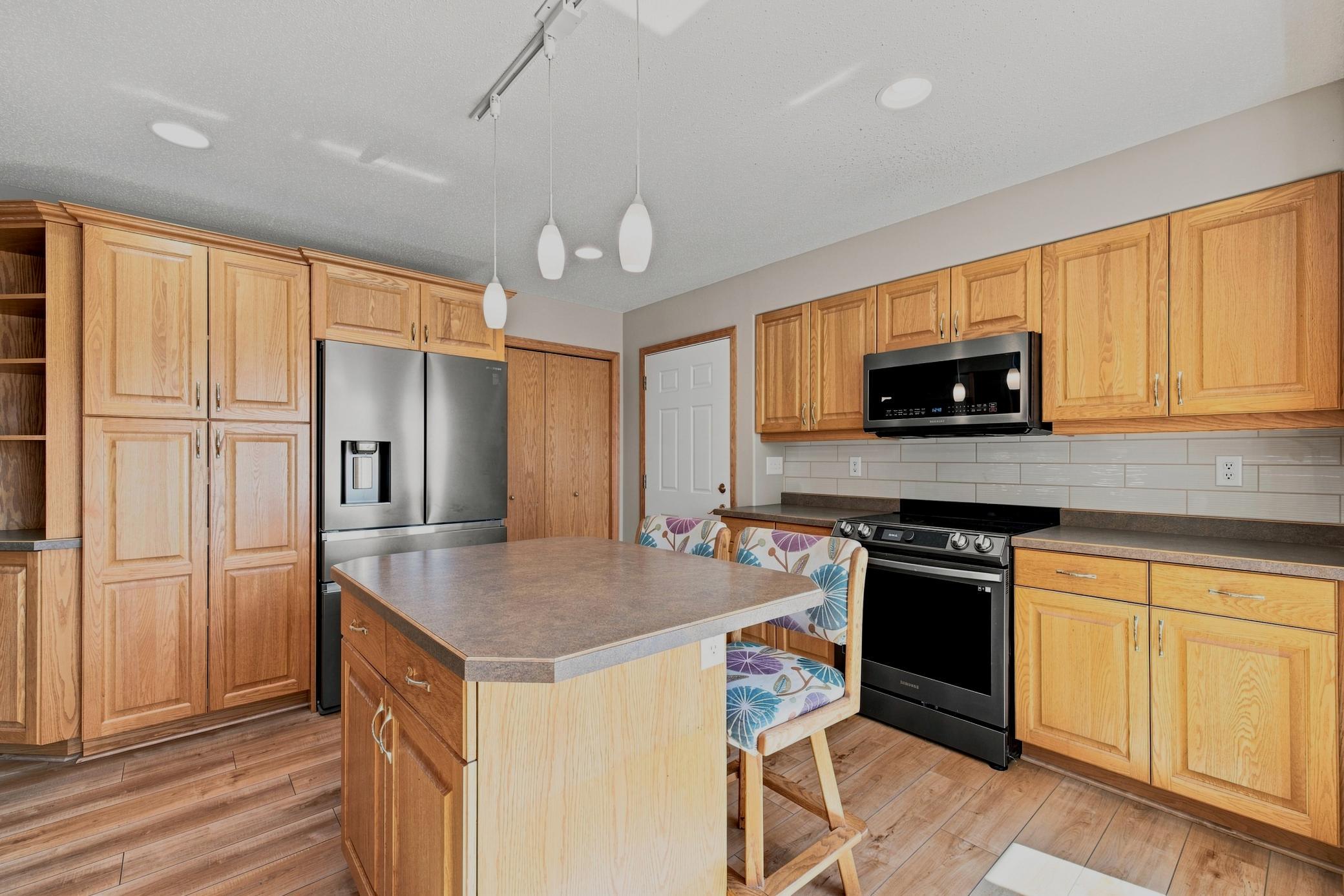Pantry closet, garage entry, floor-to-ceiling cabinets