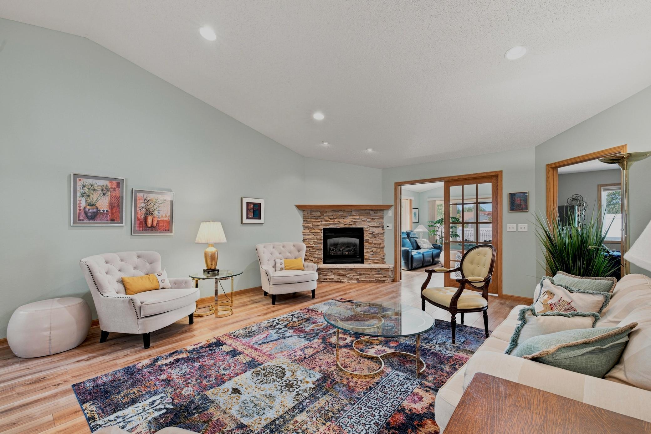 Living Room with vaulted ceilings, fireplace, recessed lights