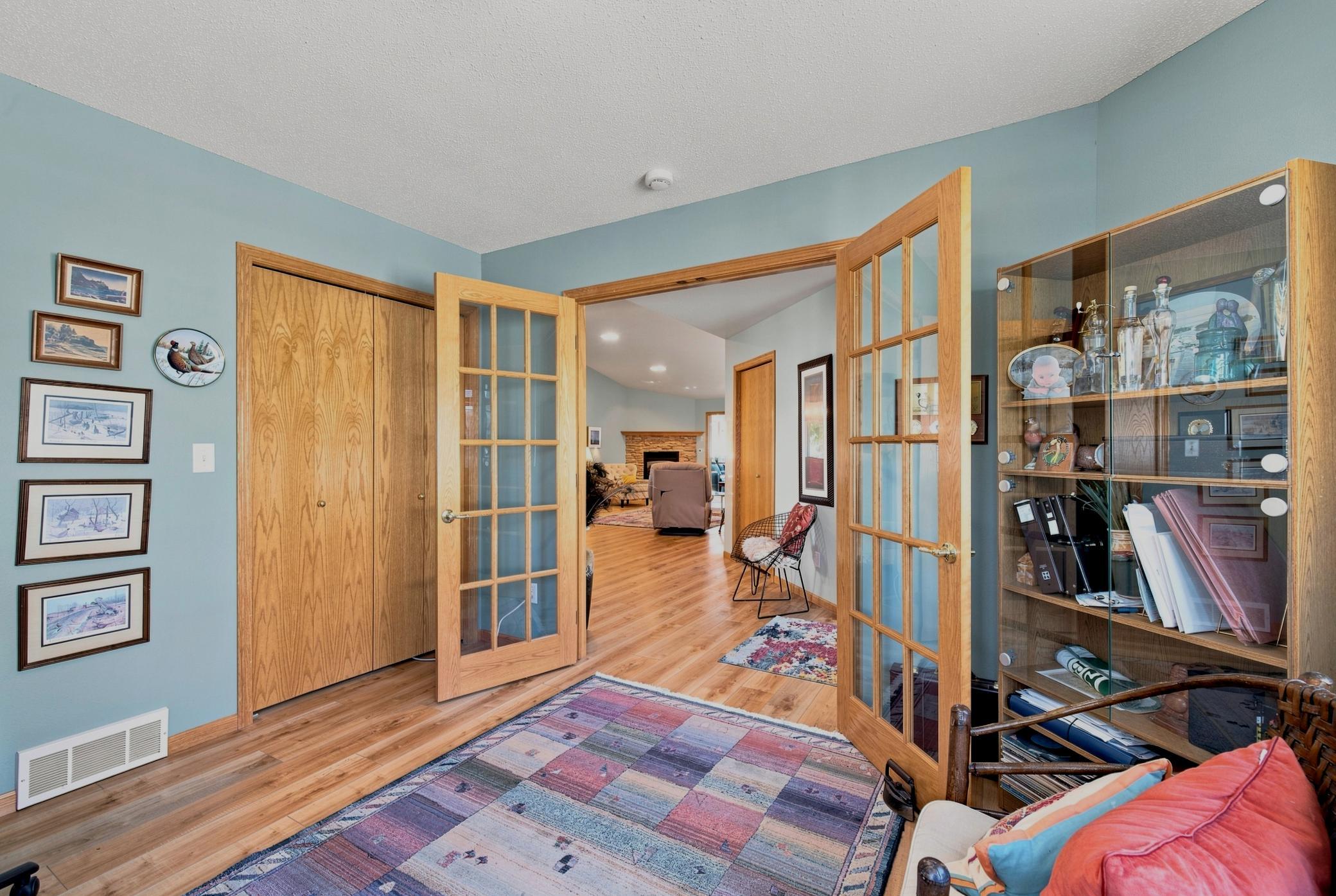 Bedroom 1/Office has a good-sized closet & French doors