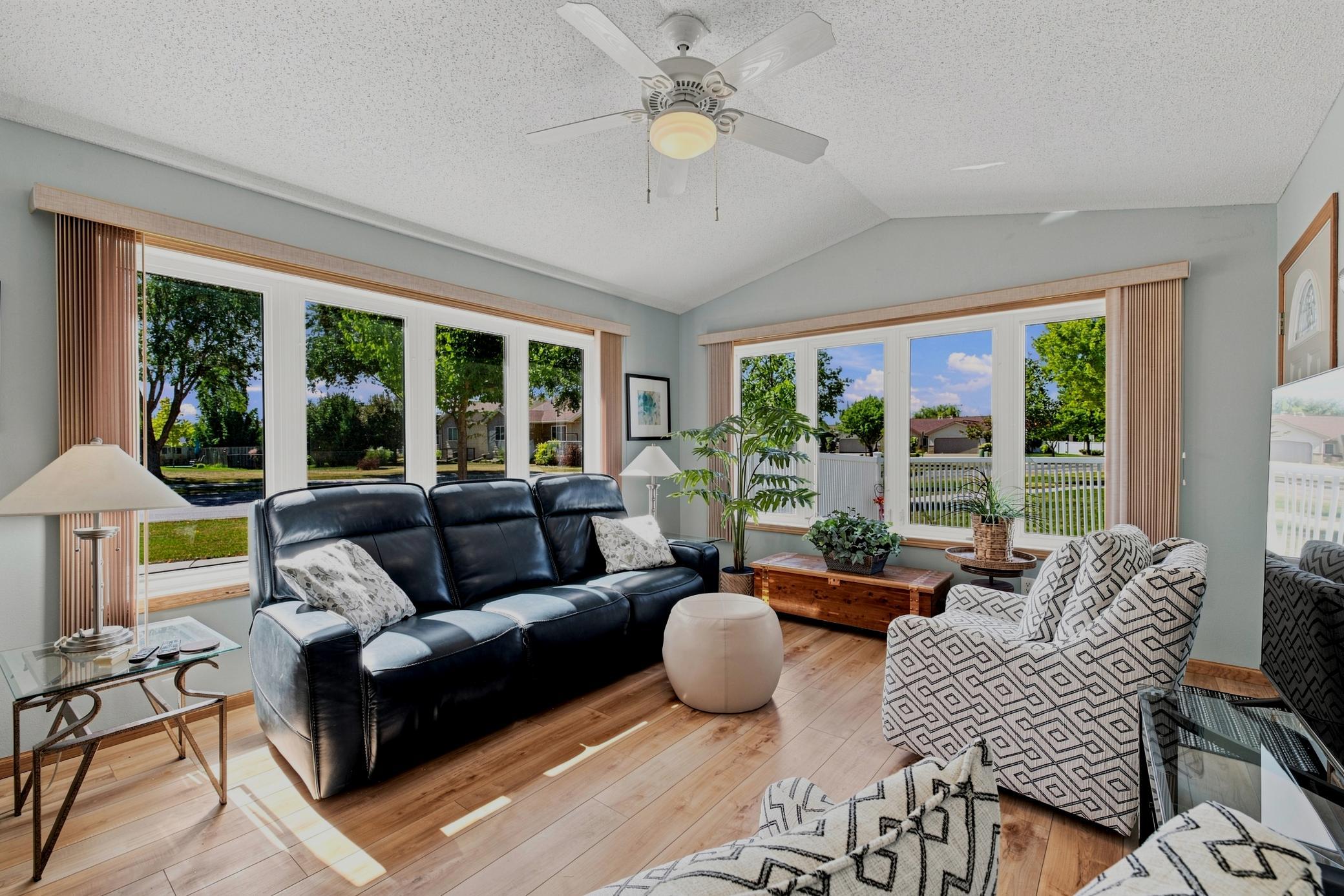 Sunroom offers vaulted ceilings, tons of light, large windows, access to patio