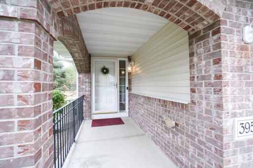 Brick front with covered walkway to front door