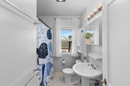 Main floor full bath with window to backyard