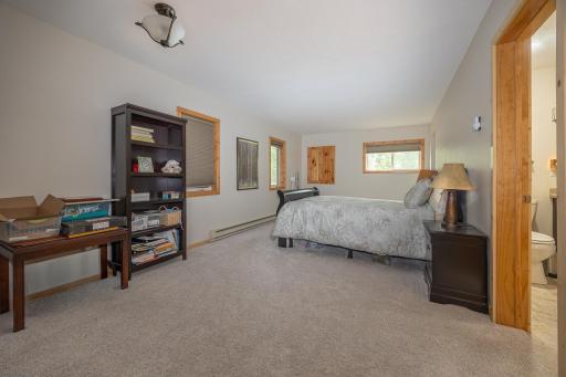 Primary main floor bedroom with walk in closet and ensuite bathroom
