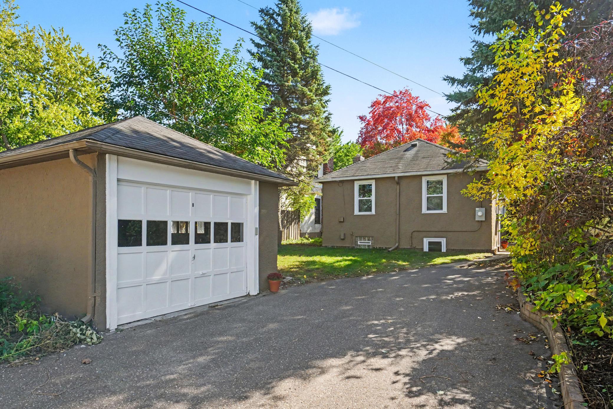 Garage & parking area from alley with yard