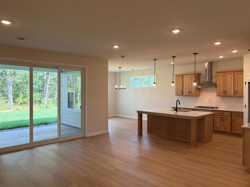 A reverse look showing how the living, kitchen, and dining room all come together.