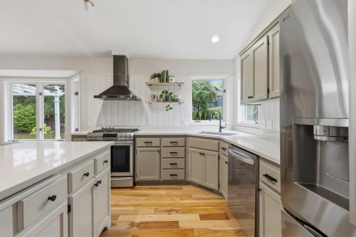 Quartz countertops and backsplash with shiplap accent walls