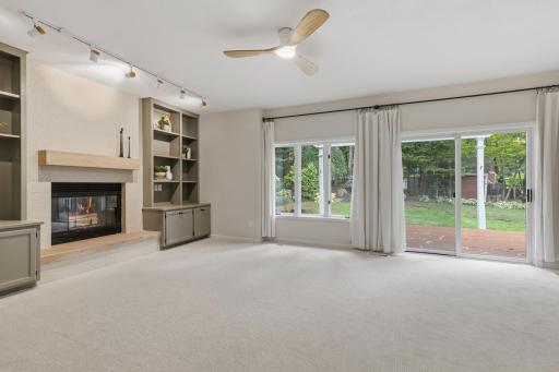 Family Room features full glass patio door with access to the deck and property