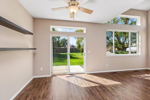 Slider in living room leads to patio with nice yard