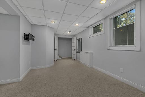 A view back toward the entrance of the primary suite, featuring attractive double doors for added character and privacy.
