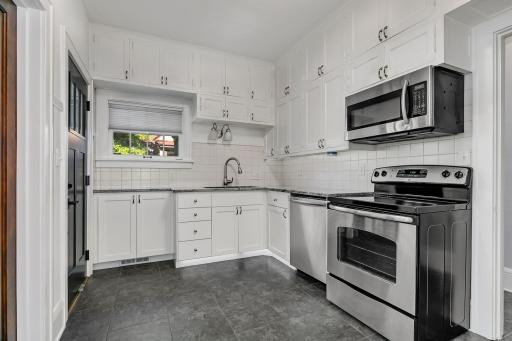 Spacious kitchen with tons of cabinet storage and stainless steel appliances, offering both functionality and style for everyday living.