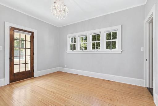 Another view of the formal dining room, featuring convenient access to the bright and inviting sunroom.