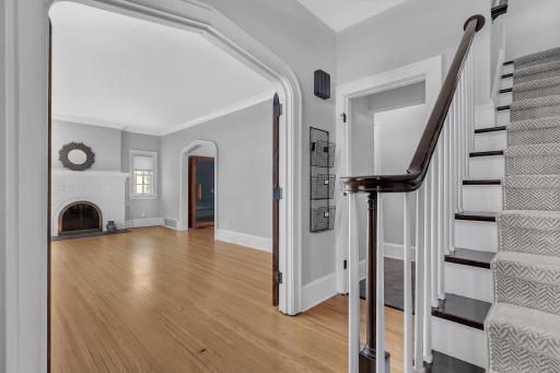 View from the front entryway showcasing the living room and its beautiful custom arched doorway.