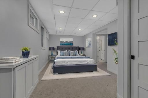 A virtually staged photo of the lower level bedroom.